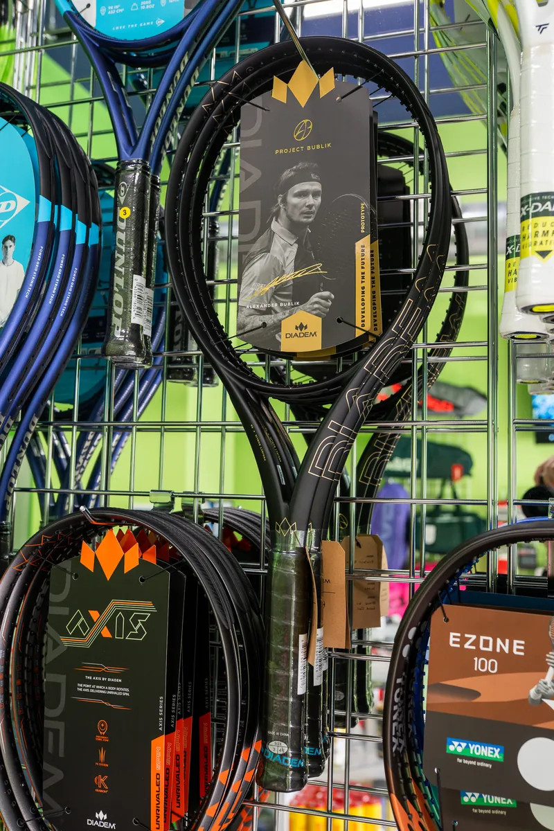 A Diadem Axis Project Bublik racquet on the wall at URacquet Shop