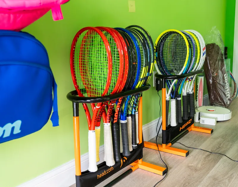 Demo racquets in a rack at URacquet Shop